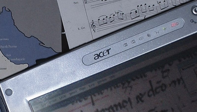 Acer laptop with music notation — early Music Technology program work